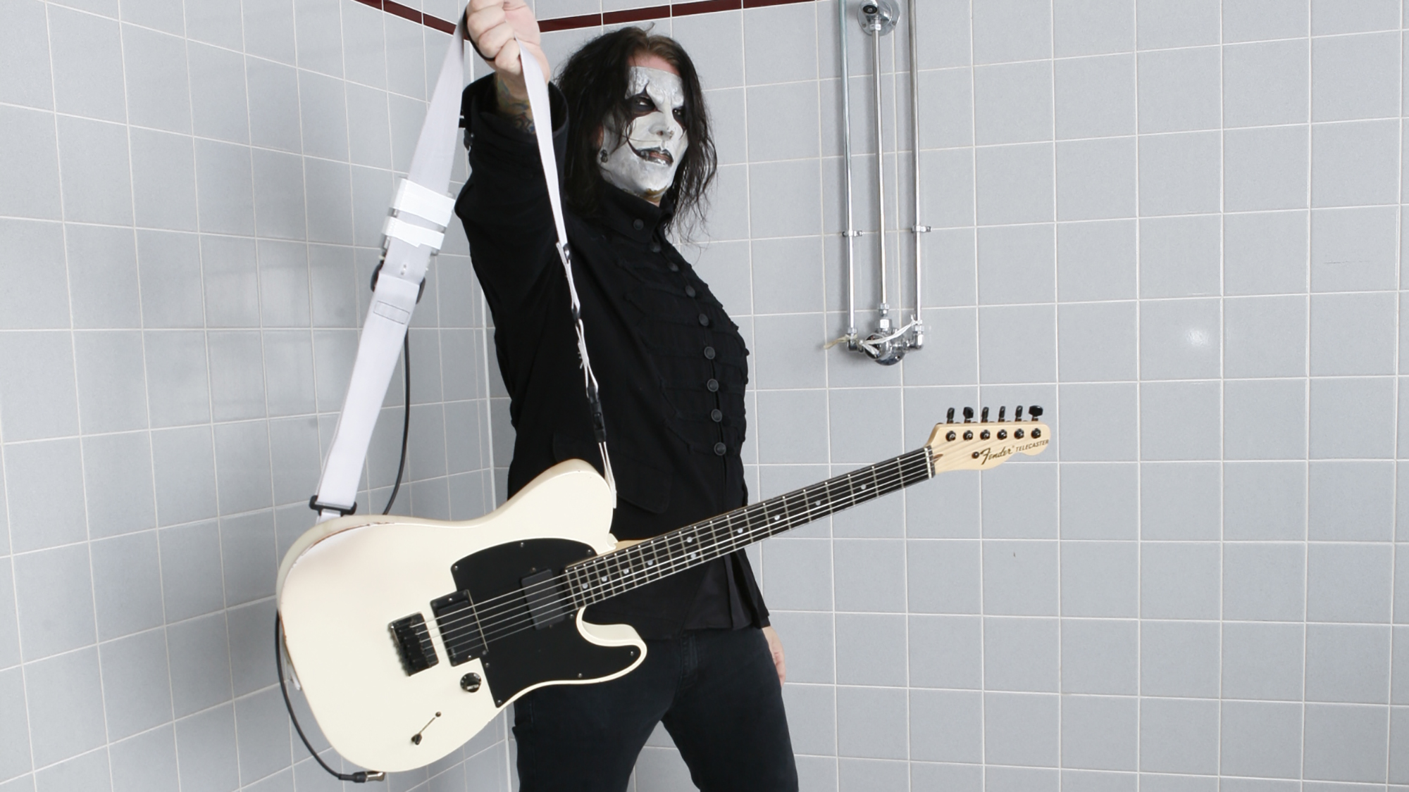 Jim Root holding up his Fender Telecaster signature